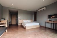 Postel nebo postele na pokoji v ubytování Riverawan Hotel