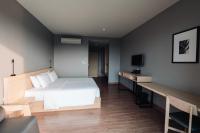 Postel nebo postele na pokoji v ubytování Riverawan Hotel