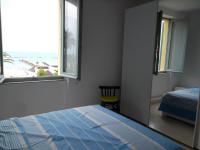 A bed or beds in a room at Grottammare mon amour Marina Grande