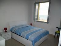 A bed or beds in a room at Grottammare mon amour Marina Grande