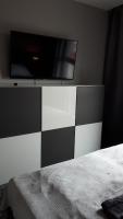 Televízia a/alebo spoločenská miestnosť v ubytovaní Apartament Stara Gazownia