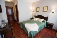 Postel nebo postele na pokoji v ubytování Hotel El Repelao