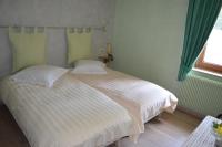 Krevet ili kreveti u jedinici u okviru objekta Logis Hotel Les Vosges