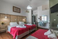 Postel nebo postele na pokoji v ubytování Aklidi Hotel
