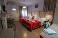 Postel nebo postele na pokoji v ubytování Aklidi Hotel