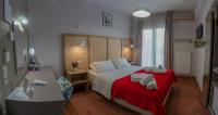 Postel nebo postele na pokoji v ubytování Aklidi Hotel