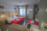 Postel nebo postele na pokoji v ubytování Aklidi Hotel