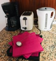 Příslušenství pro přípravu čaje a kávy v ubytování Holiday Apartment