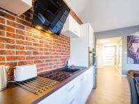 Kuchyňa alebo kuchynka v ubytovaní Apartament Wakacyjny z tarasem