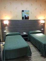 Postel nebo postele na pokoji v ubytování Hotel Nacional Melilla