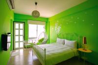 a green bedroom with a bed and a swing at Blue Ocean Sunny BS in Checheng