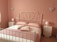 A bed or beds in a room at Appartamenti Monte Alago
