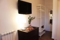 Televízia a/alebo spoločenská miestnosť v ubytovaní Il Giardino di Laura Private Rooms Mondello