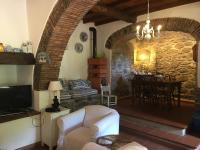 A seating area at Relax totale nel Bosco Lucca