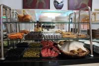 a buffet filled with lots of different types of food at Grand Georgian Palace in Batumi