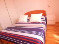 Posteľ alebo postele v izbe v ubytovaní Apartman Karlo