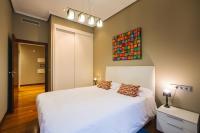 Posteľ alebo postele v izbe v ubytovaní Apartamentos San Marcial 28
