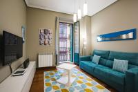 Televízia a/alebo spoločenská miestnosť v ubytovaní Apartamentos San Marcial 28