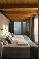 Postel nebo postele na pokoji v ubytování Apartamentos y Villas La Santilar
