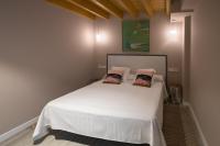 Postel nebo postele na pokoji v ubytování Apartamentos y Villas La Santilar
