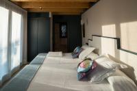 Postel nebo postele na pokoji v ubytování Apartamentos y Villas La Santilar