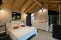 Postel nebo postele na pokoji v ubytování Apartamentos y Villas La Santilar