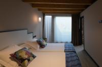 Postel nebo postele na pokoji v ubytování Apartamentos y Villas La Santilar