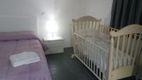 A bed or beds in a room at Lilium In B&B