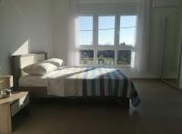 Postel nebo postele na pokoji v ubytování Sun Apartments