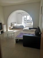 Postel nebo postele na pokoji v ubytování Sun Apartments