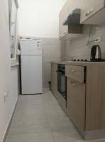Kuchyň nebo kuchyňský kout v ubytování Sun Apartments