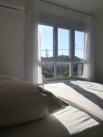 Postel nebo postele na pokoji v ubytování Sun Apartments