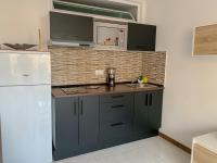 Kuchyň nebo kuchyňský kout v ubytování Apartamento Luxury