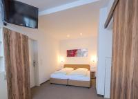 Posteľ alebo postele v izbe v ubytovaní Hotel Bayrischer Hof