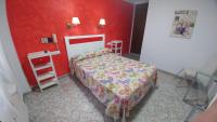 Postel nebo postele na pokoji v ubytování Hotel Doña Carmen