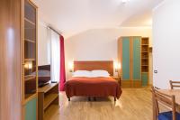 Postel nebo postele na pokoji v ubytování Duskova Apartments
