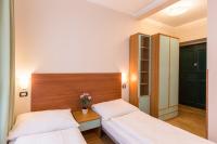 Postel nebo postele na pokoji v ubytování Duskova Apartments