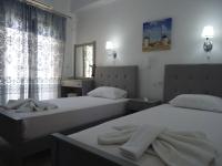 A bed or beds in a room at Kallithea Studios