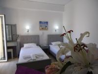 A bed or beds in a room at Kallithea Studios