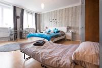 A bed or beds in a room at Cute Red Star Studio City Center