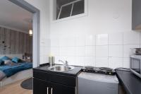 A kitchen or kitchenette at Cute Red Star Studio City Center