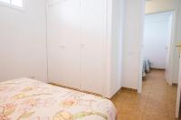 Postel nebo postele na pokoji v ubytování Los Cristianos 3