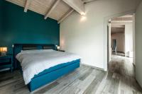 A bed or beds in a room at REFUGIUM CountryHouse