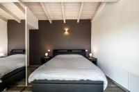 A bed or beds in a room at REFUGIUM CountryHouse