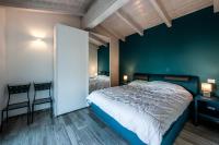 A bed or beds in a room at REFUGIUM CountryHouse