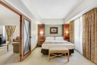 a hotel room with a bed and a television at Harrah's Lake Tahoe Hotel & Casino in Stateline
