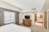 a hotel room with a bed and a television at Harrah's Lake Tahoe Hotel & Casino in Stateline