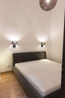 A bed or beds in a room at New Loft Style Appartman in the heart of the City