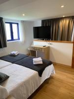 Posteľ alebo postele v izbe v ubytovaní hotel la trainera