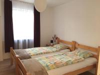 Łóżko lub łóżka w pokoju w obiekcie Piknik Apartmant